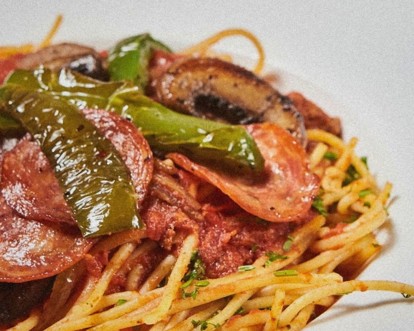 Spaghetti Caruso with sausage, peppers and mushrooms